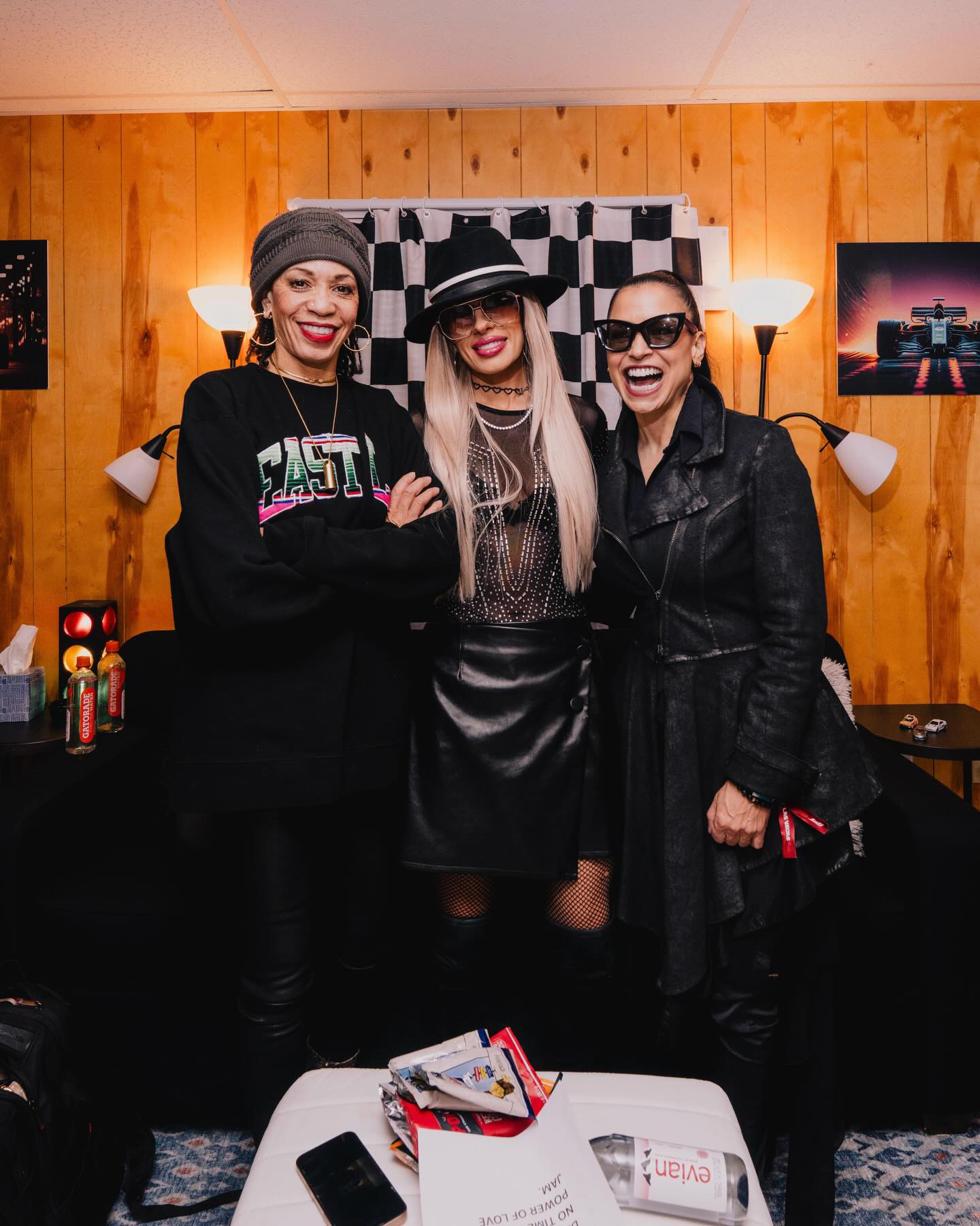 Cindy Blackman Santana, Orianthi and Rhonda Smith smiling backstage